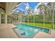 Refreshing screened pool surrounded by a large patio area at 4376 Corso Venetia Blvd, Venice, FL 34293