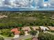 Bird's eye view of a house and surrounding landscape at 4376 Corso Venetia Blvd, Venice, FL 34293