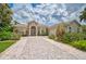 Modern two-story home with a stone driveway and landscaping at 4376 Corso Venetia Blvd, Venice, FL 34293