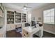 Home office with built-in bookcases and plenty of workspace at 4376 Corso Venetia Blvd, Venice, FL 34293