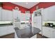 Bright kitchen features white cabinets, granite counters, and double oven at 4376 Corso Venetia Blvd, Venice, FL 34293