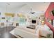 Open concept living room with a view of the pool and dining area at 4376 Corso Venetia Blvd, Venice, FL 34293