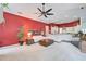 Open living space with kitchen access and red accent wall at 4376 Corso Venetia Blvd, Venice, FL 34293