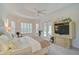Spacious main bedroom with a king bed and access to the pool at 4376 Corso Venetia Blvd, Venice, FL 34293