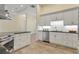 Well-equipped kitchen featuring stainless steel appliances and white cabinetry at 233 Fairway Rd, Rotonda West, FL 33947