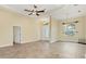 Bright and airy living room with tile floors and access to the backyard at 233 Fairway Rd, Rotonda West, FL 33947