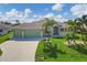Single Gathering home exterior with two-car garage at 233 Fairway Rd, Rotonda West, FL 33947