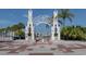 Ornate archway entrance to Sarasota Bayfront, with palm trees and water views at 332 Cocoanut Ave # 503, Sarasota, FL 34236