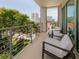 Private balcony with comfortable seating and city views at 332 Cocoanut Ave # 503, Sarasota, FL 34236
