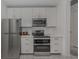 Modern kitchen featuring stainless steel appliances and white cabinetry at 332 Cocoanut Ave # 503, Sarasota, FL 34236