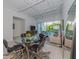 Bright living room features an open floor plan, stylish furniture, and glass dining table at 332 Cocoanut Ave # 503, Sarasota, FL 34236