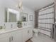 Modern bathroom with double vanity, bathtub, and shower at 332 Cocoanut Ave # 503, Sarasota, FL 34236