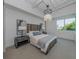 Bright bedroom with a comfortable bed, nightstands, and large window at 332 Cocoanut Ave # 503, Sarasota, FL 34236