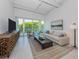 Modern living room with large windows and city views at 332 Cocoanut Ave # 503, Sarasota, FL 34236