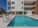 Refreshing community pool with ample lounge space at 332 Cocoanut Ave # 503, Sarasota, FL 34236