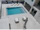 Communal pool with patio furniture and lounge chairs at 332 Cocoanut Ave # 503, Sarasota, FL 34236