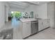 Open concept kitchen with stainless steel appliances and island at 332 Cocoanut Ave # 503, Sarasota, FL 34236