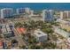 Aerial view showcasing a building's location in a bustling urban setting near the water at 332 Cocoanut Ave # 503, Sarasota, FL 34236