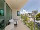 Private balcony with city views and comfortable seating at 332 Cocoanut Ave # 503, Sarasota, FL 34236