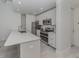 Modern kitchen with stainless steel appliances and white cabinets at 332 Cocoanut Ave # 503, Sarasota, FL 34236