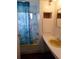 Bathroom with shower, toilet, vanity with yellow sink, and patterned curtain at 427 Boxwood Dr, Venice, FL 34285