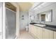 Bathroom with updated vanity, walk-in shower, and tiled floor, offering a modern look at 4619 Flint Dr, North Port, FL 34286