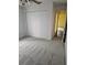 Bright carpeted bedroom with a closet and doorway to the rest of the house at 4619 Flint Dr, North Port, FL 34286