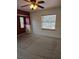 Neutral bedroom with carpet, ceiling fan, and natural light from two windows at 4619 Flint Dr, North Port, FL 34286