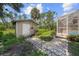 Large backyard with shed and spacious grassy area at 4619 Flint Dr, North Port, FL 34286