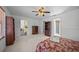 Bedroom with carpet, built-in shelving, and view into kitchen at 4619 Flint Dr, North Port, FL 34286