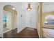 Bright entryway with hardwood floors and arches at 4619 Flint Dr, North Port, FL 34286