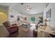 Living area features hardwood floors, comfortable furniture, and pool view at 4619 Flint Dr, North Port, FL 34286
