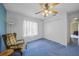 Bright bedroom with carpeted floor, window, and a built-in closet at 4619 Flint Dr, North Port, FL 34286