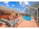 Inviting screened-in pool with patio and lounge chairs at 4619 Flint Dr, North Port, FL 34286