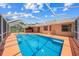 Spacious pool with a large patio area at 4619 Flint Dr, North Port, FL 34286