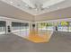 Large community room with hardwood floors and access to pool at 600 Carriage House Ln # 104, Nokomis, FL 34275