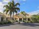 Landscaped entrance to the community clubhouse at 600 Carriage House Ln # 104, Nokomis, FL 34275