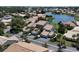 Aerial view of waterfront community with lush landscaping and multiple homes at 600 Carriage House Ln # 104, Nokomis, FL 34275