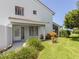 Charming condo with private entrance, covered patio, and manicured lawn at 600 Carriage House Ln # 104, Nokomis, FL 34275