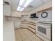 Simple kitchen in community clubhouse at 600 Carriage House Ln # 104, Nokomis, FL 34275