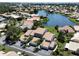 Aerial view of a waterfront community with lush landscaping at 600 Carriage House Ln # 104, Nokomis, FL 34275