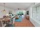Bright living room with tile floors, comfy seating, and access to a patio at 600 Carriage House Ln # 104, Nokomis, FL 34275