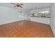 Living room with tile floors and kitchen pass-through at 600 Carriage House Ln # 104, Nokomis, FL 34275