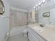 Clean bathroom, featuring a bathtub, toilet and vanity at 600 Carriage House Ln # 104, Nokomis, FL 34275