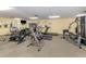 Fitness center featuring treadmills, stationary bikes, and weight machines at 600 Carriage House Ln # 104, Nokomis, FL 34275