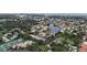 Aerial view of community, highlighting its location near water at 600 Carriage House Ln # 104, Nokomis, FL 34275