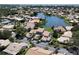 Aerial view of community featuring a lake and homes at 600 Carriage House Ln # 104, Nokomis, FL 34275