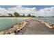 Stone jetty leading to the beach at 600 Carriage House Ln # 104, Nokomis, FL 34275