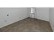 Simple bedroom with tile flooring and window coverings at 600 Carriage House Ln # 104, Nokomis, FL 34275