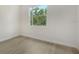 Bright bedroom with wood-look floors and window at 286 Krieger St, Port Charlotte, FL 33953